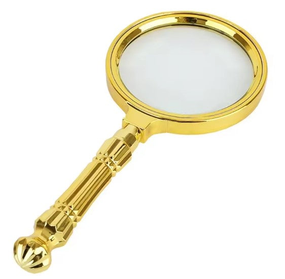 Loupe de lecture dorée