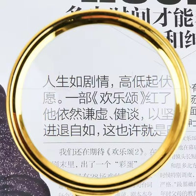 Loupe de lecture dorée